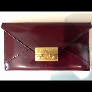 Tory Burch patent burgundy envelope card case